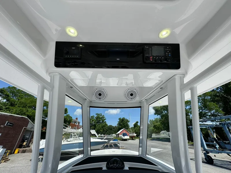 Slide: The Image of Interior view of 2024 Jupiter 340LS boat cockpit with modern controls and lighting. - 29