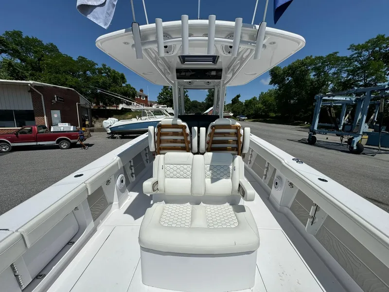 Slide: The Image of 2024 Jupiter 340LS boat interior with white seating and helm station. - 10