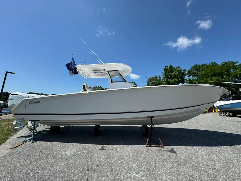 Slide: The Image of 2024 Jupiter 340LS boat on display under clear blue sky. - 3