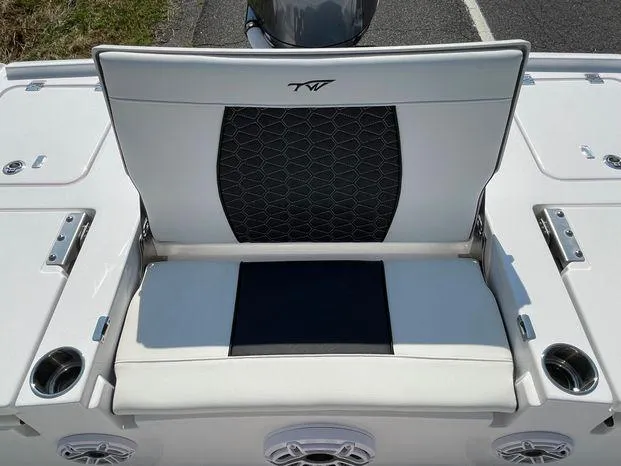 Slide: The Image of 2024 Tidewater 2500 Carolina Bay boat with seating, docked at a marina. - 12