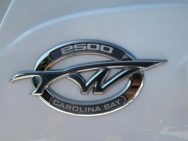 Slide: The Image of 2024 Tidewater 2500 Carolina Bay boat docked, showcasing sleek design and modern features. - 15