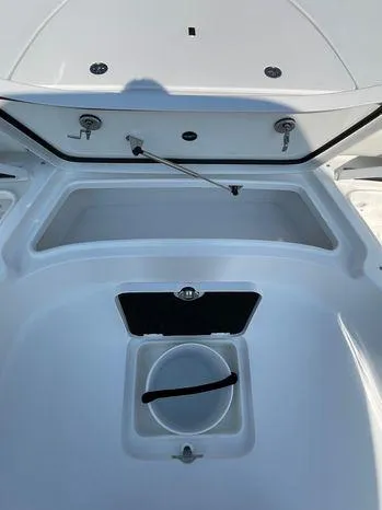 Slide: The Image of 2024 Tidewater 2500 Carolina Bay boat seat with cup holders and speaker system. - 17