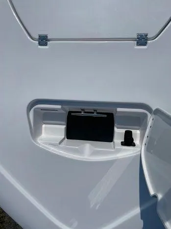 Slide: The Image of 2024 Tidewater 2500 Carolina Bay boat seat with black and white upholstery. - 18