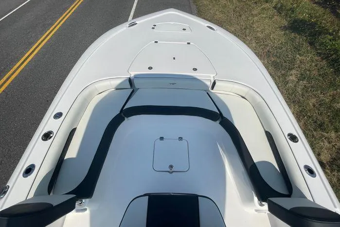 Slide: The Image of 2024 Tidewater 2500 Carolina Bay boat seats and engine on roadside. - 19