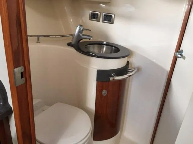 Slide: The Image of Interior cabin of 2004 Sea Ray 390 Sundancer with TV and bed. - 33