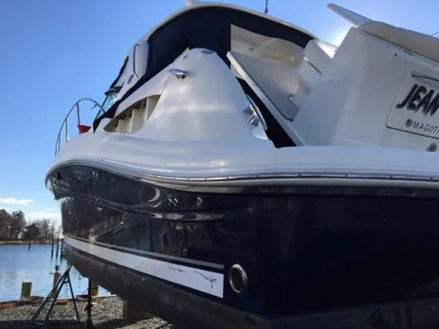 Slide: The Image of Interior of 2004 Sea Ray 390 Sundancer yacht with seating and table setup. - 8