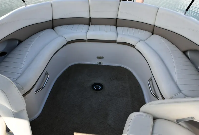 Slide: The Image of 2005 Four Winns 234 Funship boat interior with spacious seating and carpeted floor. - 12