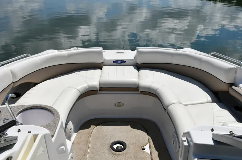 Slide: The Image of 2005 Four Winns 234 Funship boat interior with spacious seating and water reflection. - 5