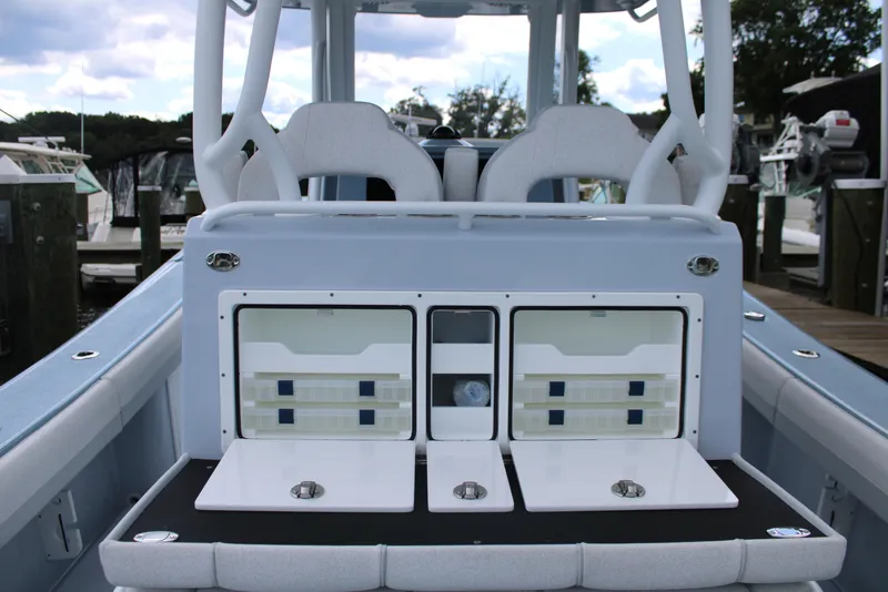 Slide: The Image of 2024 Yellowfin 36 Offshore boat interior with storage compartments and seating. - 18
