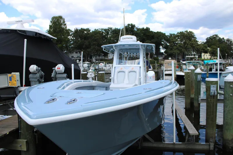 Slide: The Image of 2024 Yellowfin 36 Offshore boat docked at marina, featuring sleek design and modern equipment. - 2
