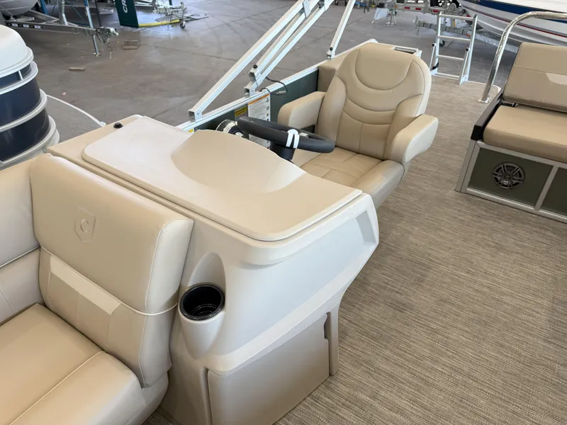 Slide: The Image of Luxurious interior of 2025 Godfrey EX2086SFLX Tritoon with plush seating and modern helm. - 10