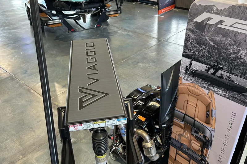 Slide: The Image of Viaggio Lago X-U 2025 boat engine display in showroom with branding and equipment. - 15