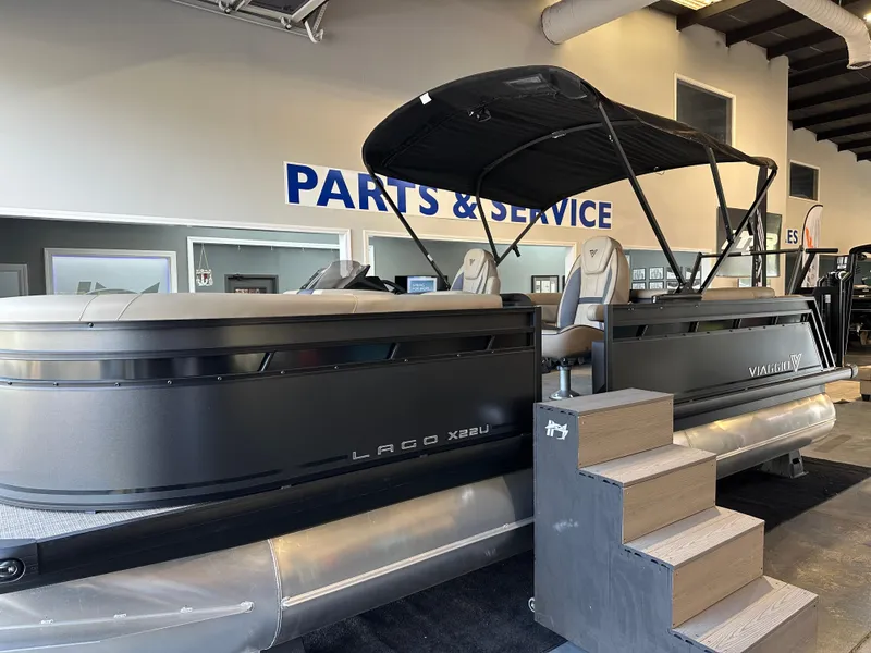 Slide: The Image of 2025 Viaggio Lago X-U pontoon boat in showroom, parts and service area. - 3