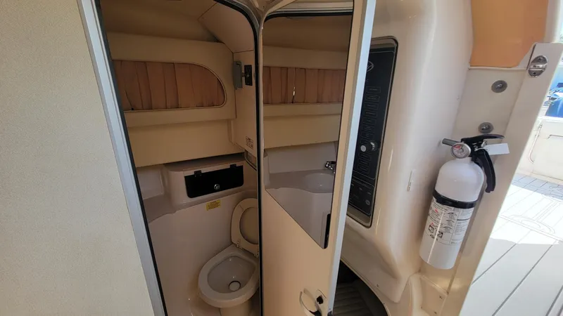 Slide: The Image of 2004 Grady-White Marlin 300 boat interior bathroom with toilet and sink. - 16