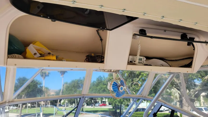 Slide: The Image of 2004 Grady-White Marlin 300 boat interior with open storage compartments. - 20