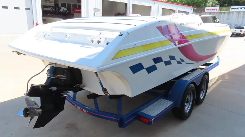 Slide: The Image of 1998 Eliminator 28 EAGLE XP boat on trailer, vibrant graphics, rear view. - 5