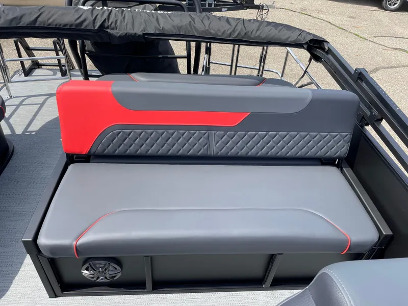 Slide: The Image of 2025 Godfrey SW2286SFLC Tritoon boat interior with modern steering console and seating. - 11