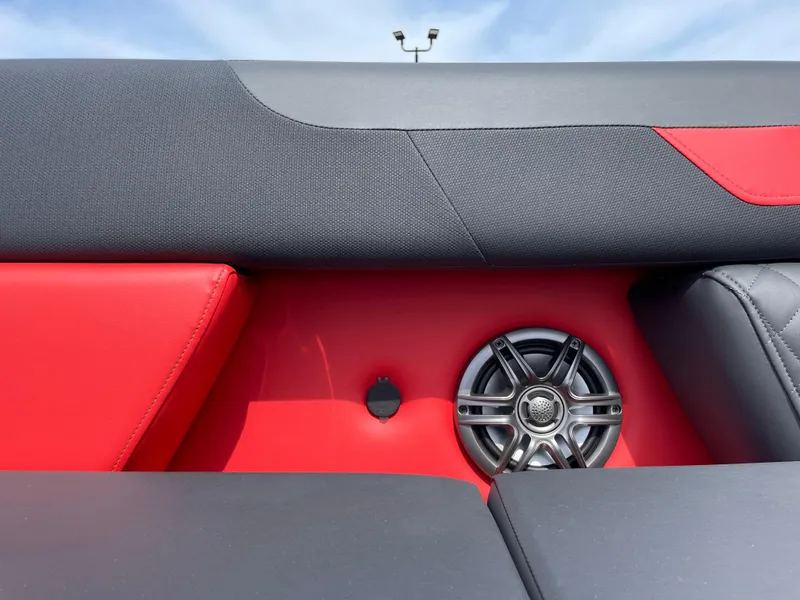 Slide: The Image of 2025 Godfrey SW2286SFLC Tritoon interior with modern seating and steering console. - 19