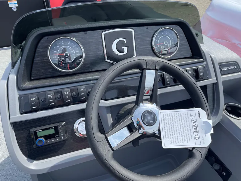 Slide: The Image of 2025 Godfrey SW2286SFLC Tritoon boat seat with gray and red upholstery. - 8