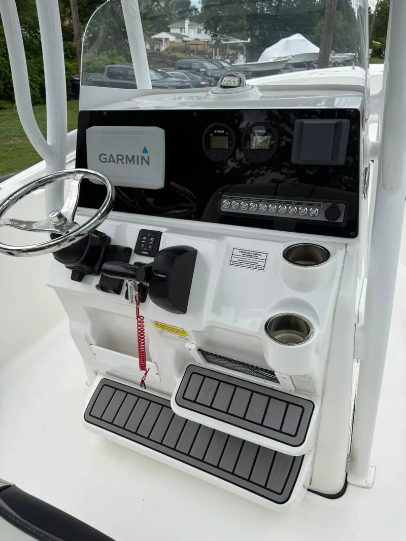 Slide: The Image of 2021 Tidewater 220 CC boat console with Garmin navigation system and dual cup holders. - 15