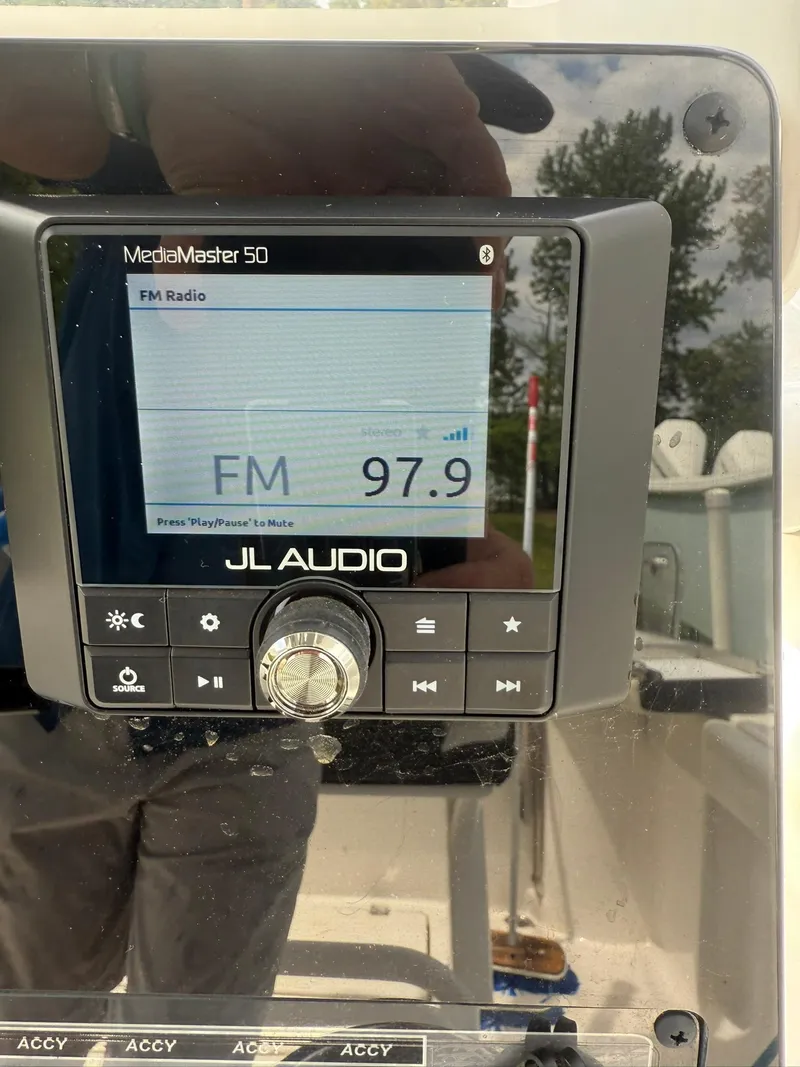 Slide: The Image of JL Audio MediaMaster 50 displaying FM 97.9 on a 2021 Tidewater 220 CC boat. - 6