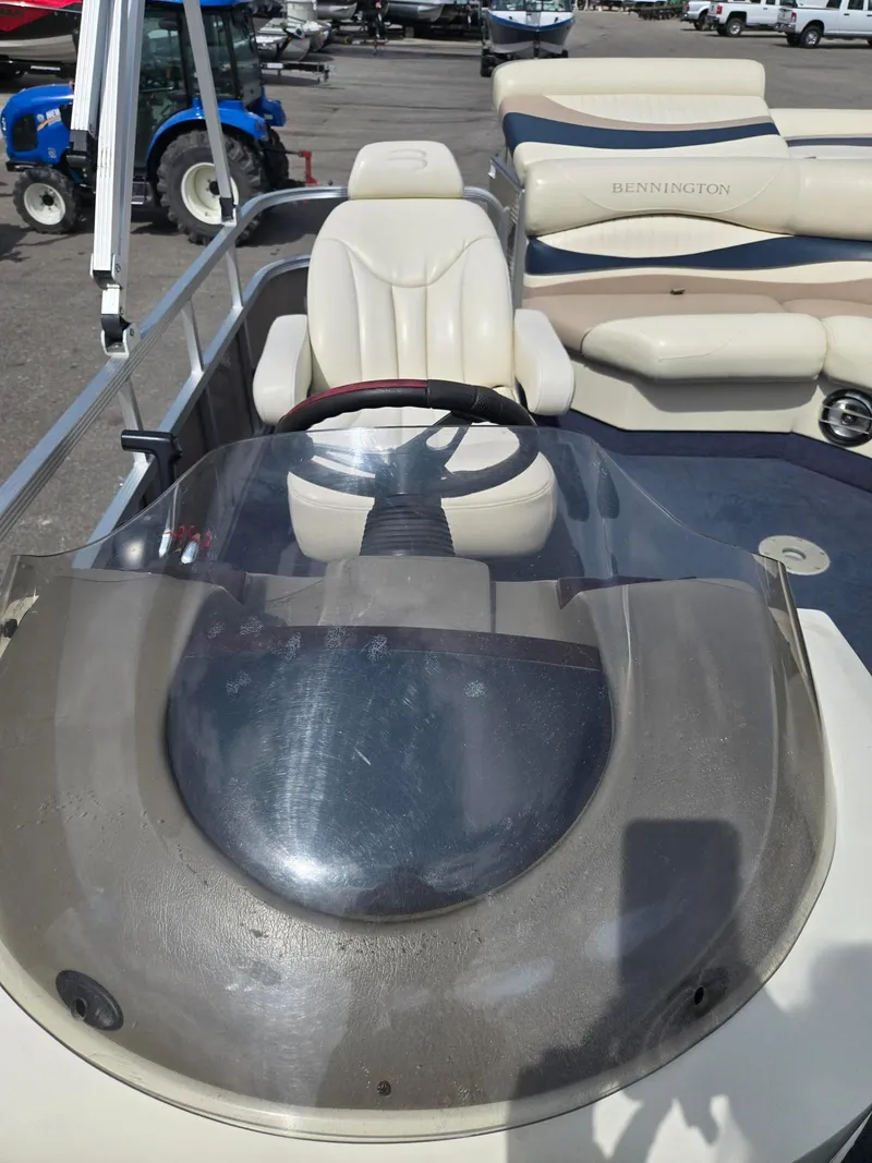 Slide: The Image of 2008 Bennington 2050 RL boat interior with steering wheel and seating. - 10