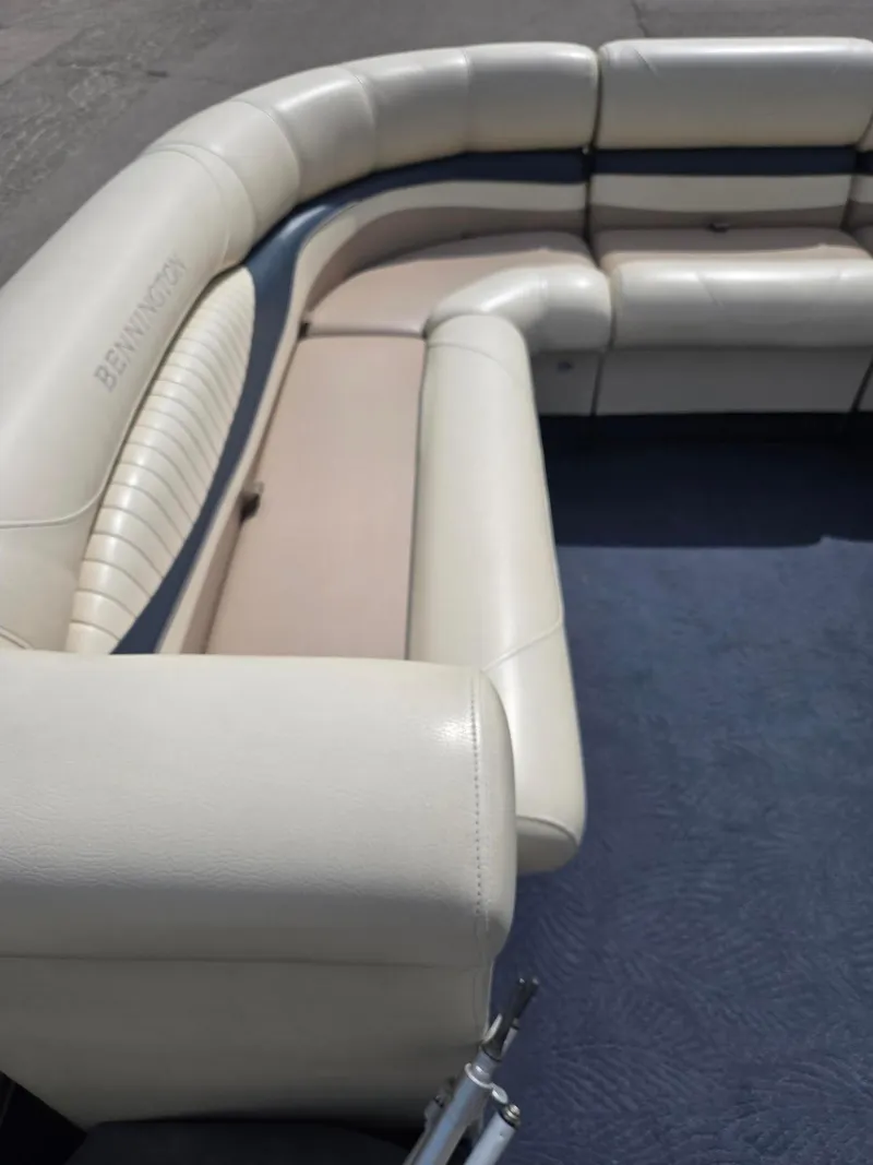 Slide: The Image of Luxurious seating on a 2008 Bennington 2050 RL boat with cream upholstery. - 15