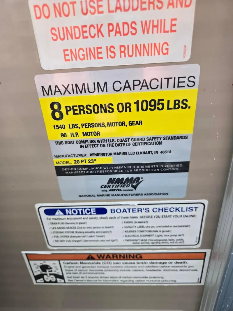 Slide: The Image of Safety and capacity labels on a 2008 Bennington 2050 RL boat. - 17