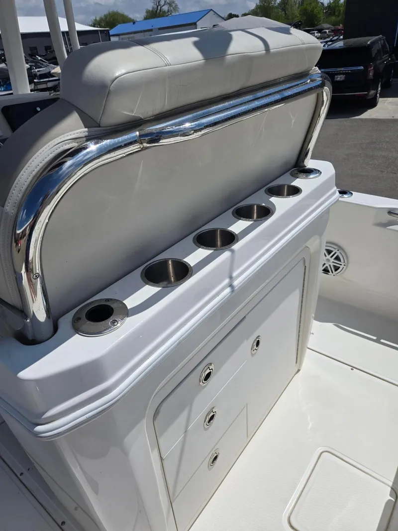 Slide: The Image of 2022 Boston Whaler Dauntless 250 boat interior with rod holders and storage compartments. - 17