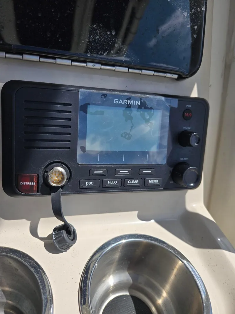 Slide: The Image of Garmin marine radio on 2022 Boston Whaler Dauntless 250 boat dashboard. - 20
