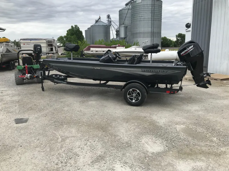 Slide: The Image of 2025 Ranger RT178 boat on trailer in outdoor setting. - 2