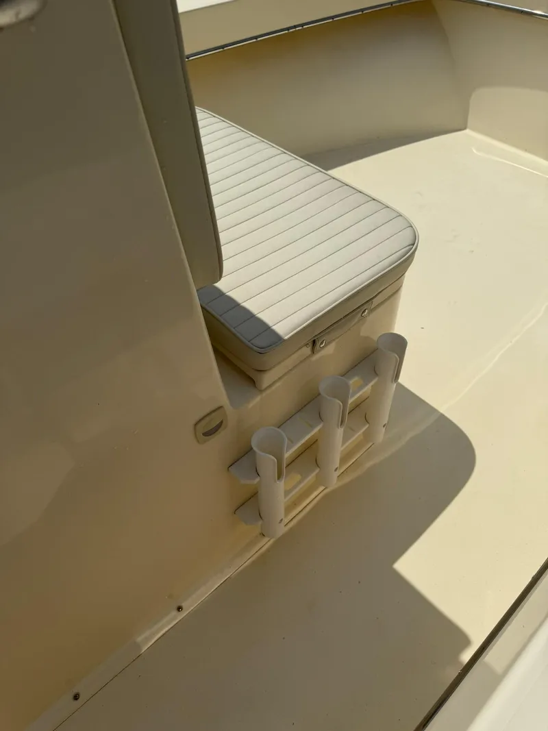 Slide: The Image of 2020 Jones Brothers 23 Cape Fisherman Lite Tackle boat interior with rod holders. - 12