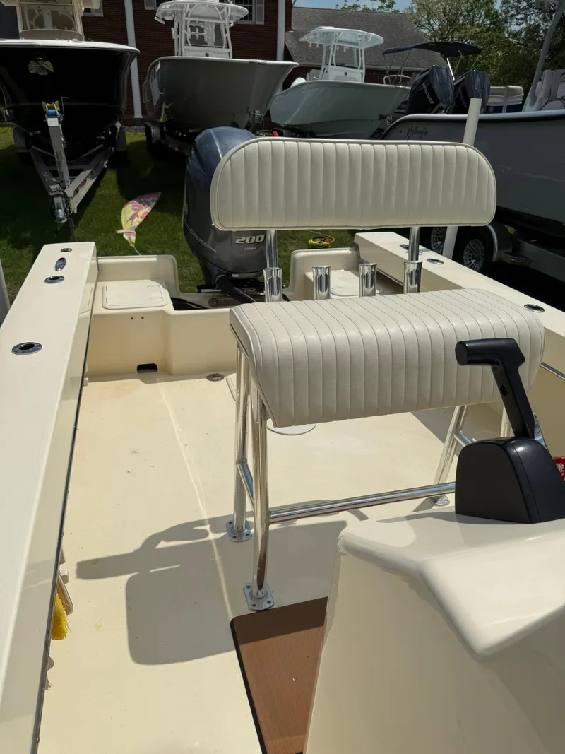 Slide: The Image of 2020 Jones Brothers 23 Cape Fisherman Lite Tackle boat interior with seating and controls. - 13
