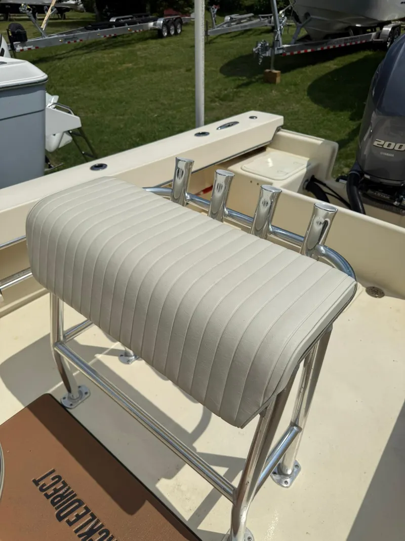 Slide: The Image of 2020 Jones Brothers 23 Cape Fisherman Lite Tackle boat with cushioned seating and rod holders. - 17