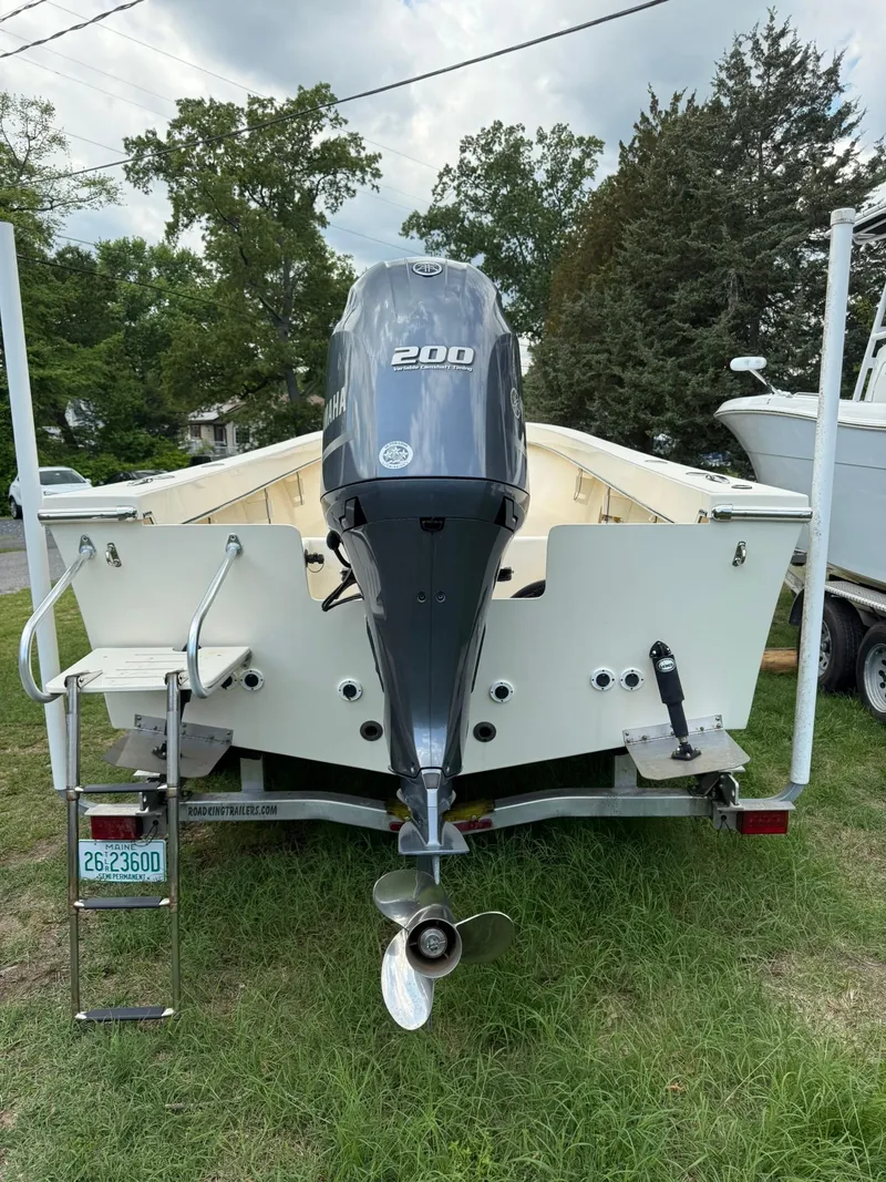 Slide: The Image of 2020 Jones Brothers 23 Cape Fisherman Lite Tackle boat with 200 HP engine, rear view. - 18
