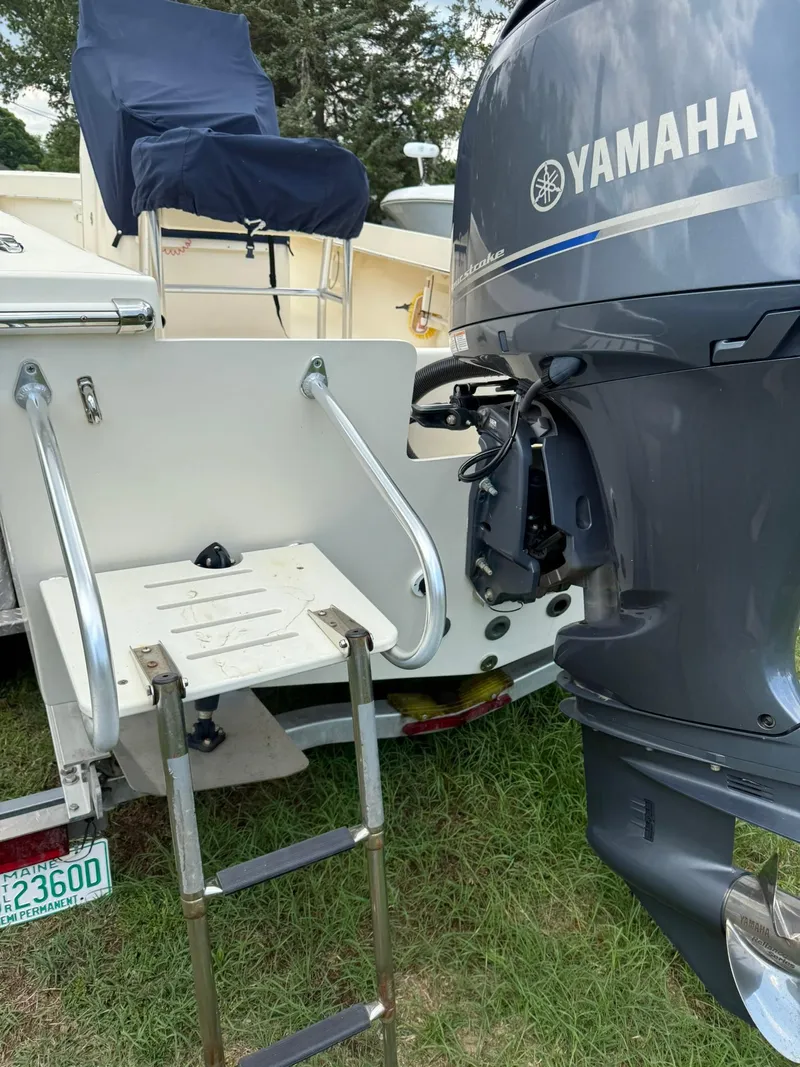 Slide: The Image of 2020 Jones Brothers 23 Cape Fisherman Lite Tackle boat with Yamaha outboard motor and swim ladder. - 22