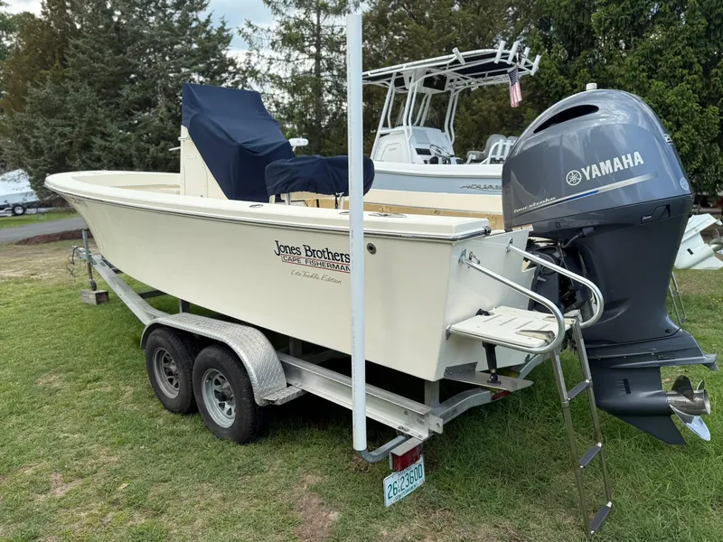 Slide: The Image of Jones Brothers 23 Cape Fisherman Lite Tackle boat, 2020 model, on trailer with Yamaha outboard. - 23