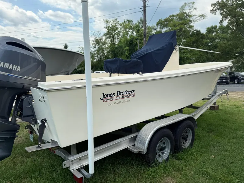 Slide: The Image of 2020 Jones Brothers 23 Cape Fisherman Lite Tackle boat on trailer, side view. - 24