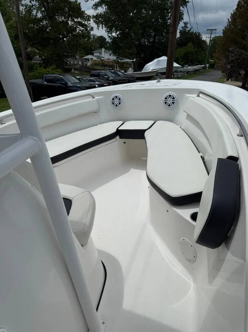 Slide: The Image of 2020 Jones Brothers 23 Cape Fisherman Lite Tackle boat interior with seating and speakers. - 28