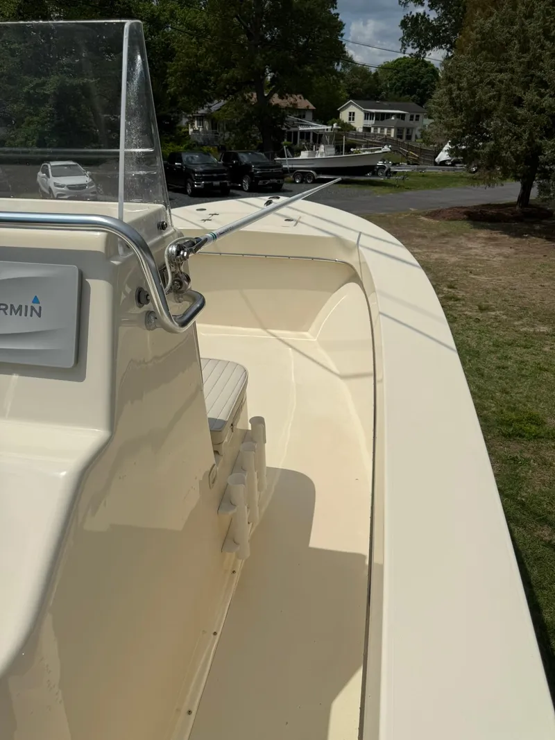 Slide: The Image of 2020 Jones Brothers 23 Cape Fisherman Lite Tackle boat, docked outdoors on a sunny day. - 6