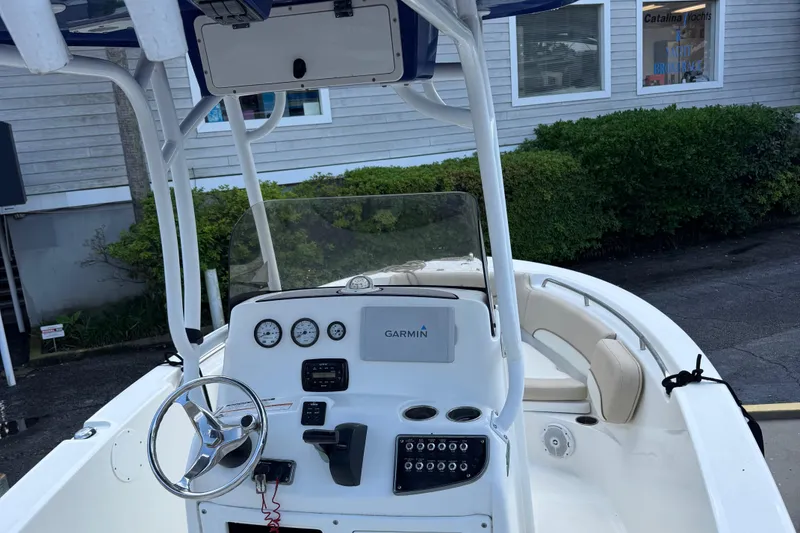 Slide: The Image of 2018 NauticStar 2102 Legacy boat interior with Garmin navigation system and steering console. - 3