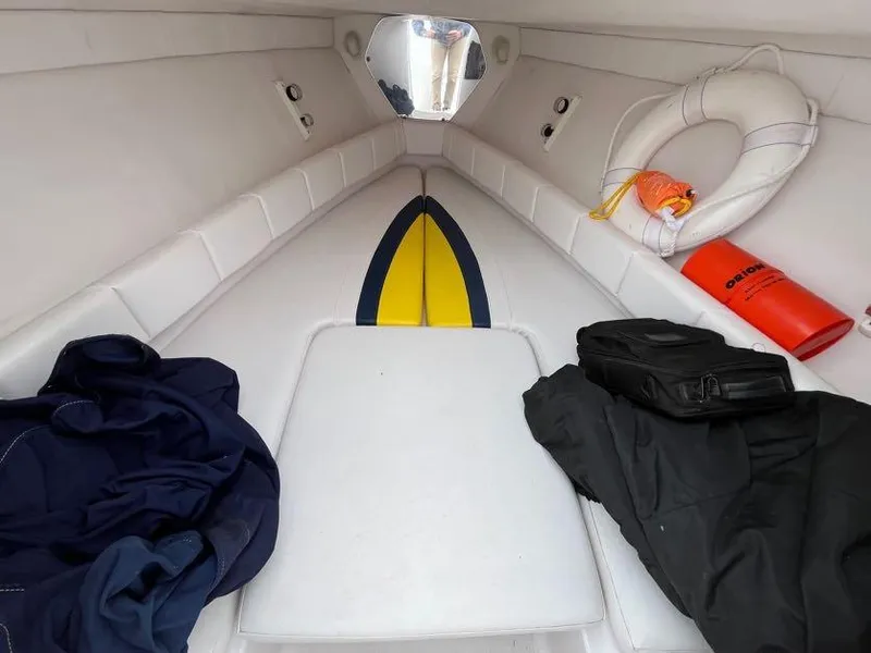 Slide: The Image of Interior of 2000 Donzi 35 ZF Daytona boat with life preserver and gear. - 11