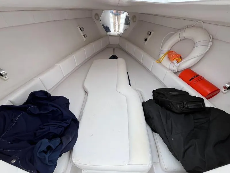 Slide: The Image of Interior of 2000 Donzi 35 ZF Daytona boat with life preserver and jackets. - 12