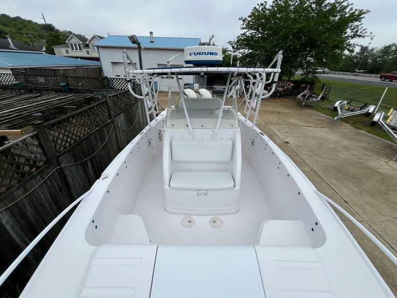 Slide: The Image of 2000 Donzi 35 ZF Daytona boat, white interior, docked outdoors. - 13