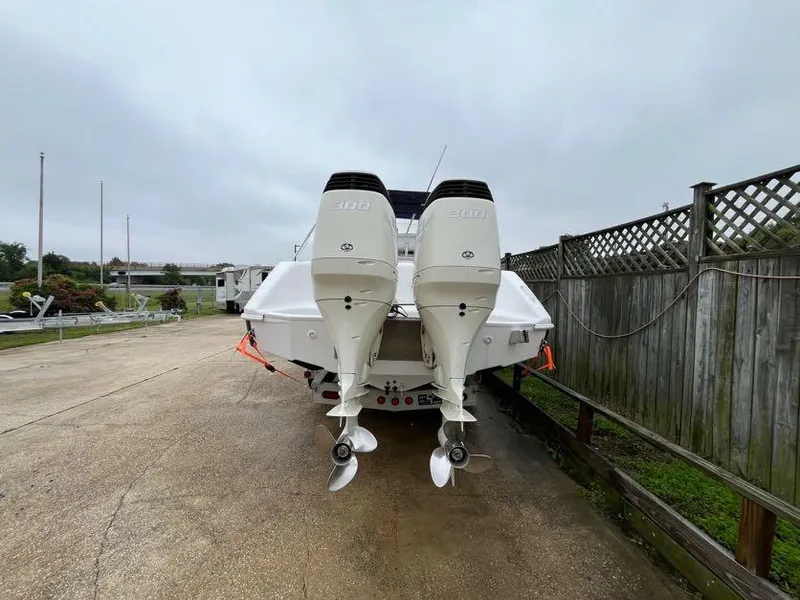Slide: The Image of Rear view of a 2000 Donzi 35 ZF Daytona boat with dual outboard engines. - 16