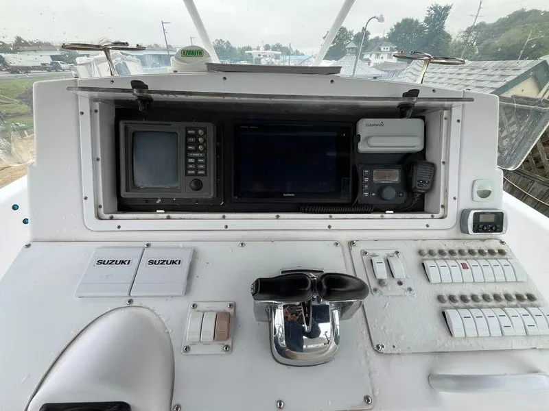 Slide: The Image of Control panel of a 2000 Donzi 35 ZF Daytona boat with navigation equipment. - 4