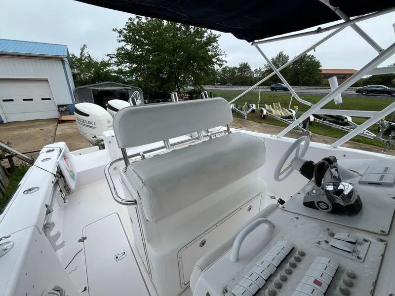 Slide: The Image of 2000 Donzi 35 ZF Daytona boat interior with helm and seating area. - 5