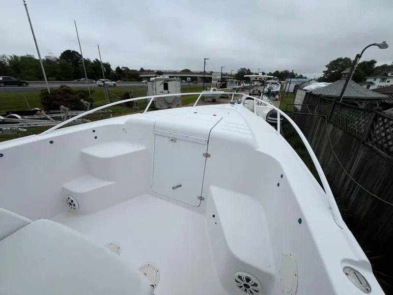 Slide: The Image of 2000 Donzi 35 ZF Daytona boat deck, featuring spacious seating and sleek design. - 9