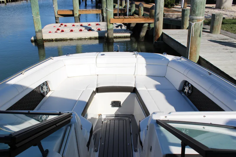 Slide: The Image of 2020 Sea Ray SDX 270 OB boat with spacious seating at a dock. - 22