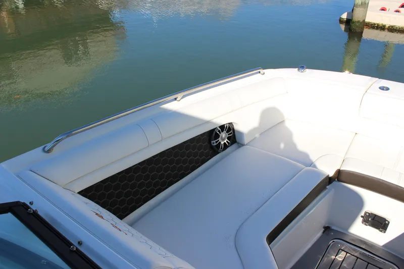 Slide: The Image of 2020 Sea Ray SDX 270 OB boat interior with white seating and water view. - 23